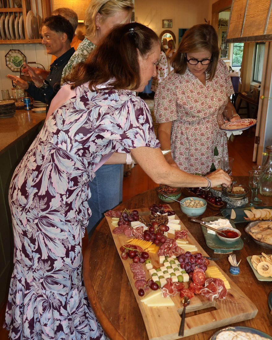 Guests gathered around the grazing table