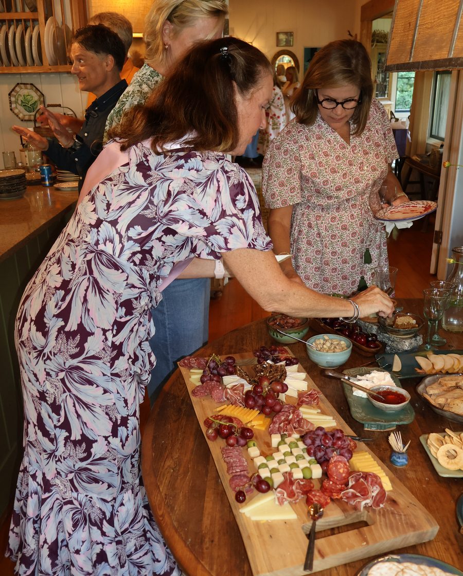 Guests gathered around the grazing table