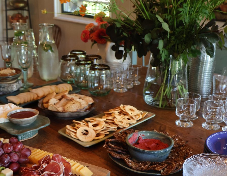 A table laid with flowers, plates and glasses