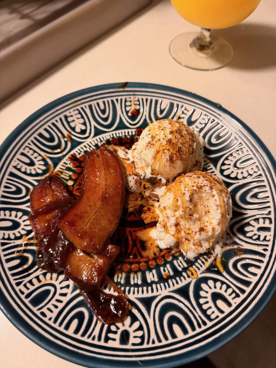 Roast fruit and ice cream on a patterned plate