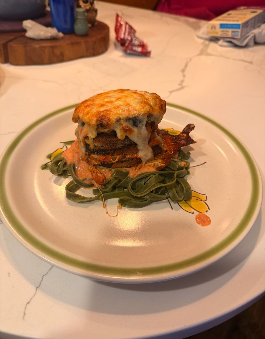 A stacked course over dressed greens