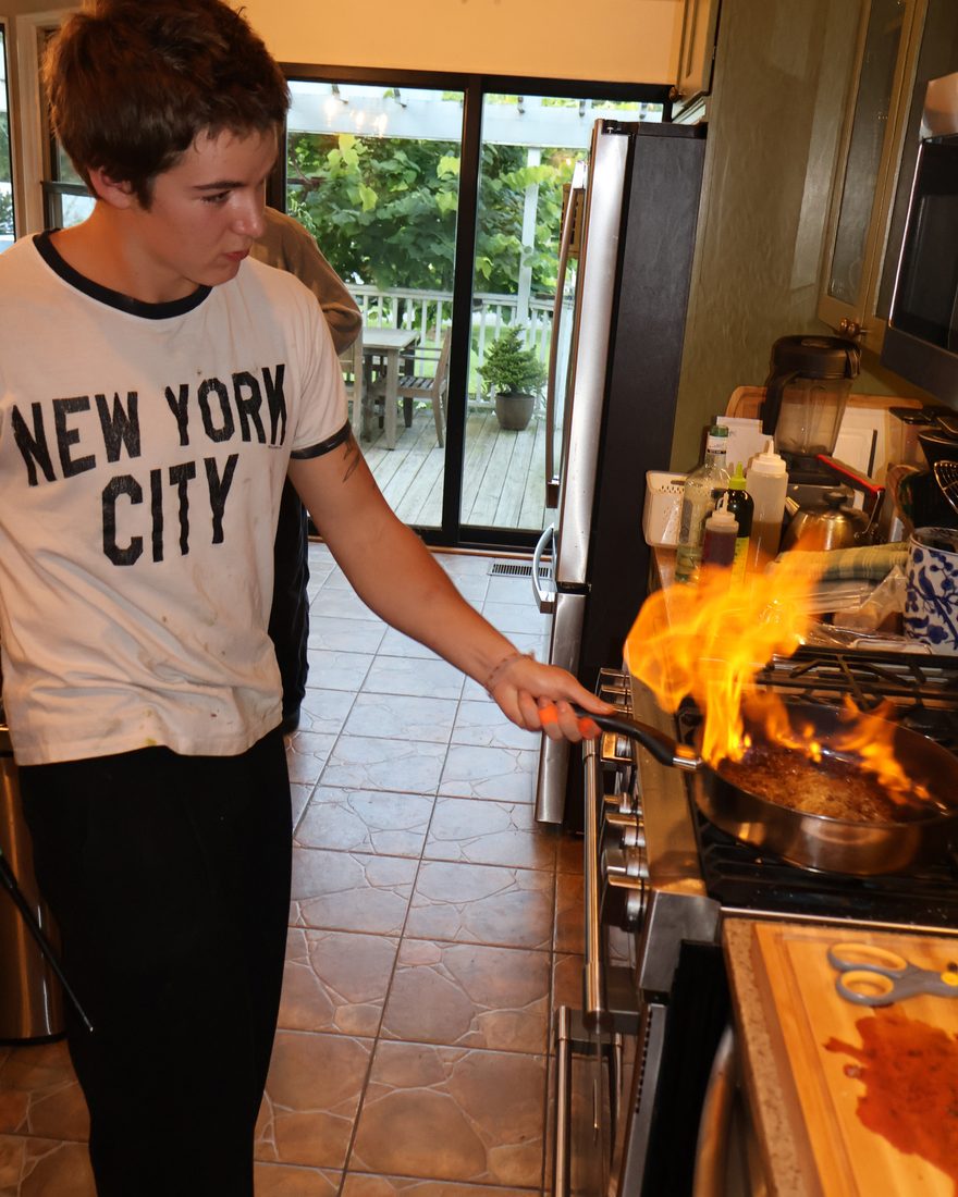 Flaming a pan at the stove