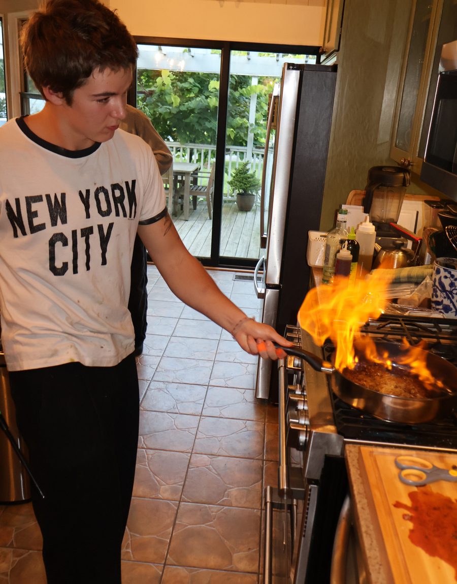 Flaming a pan at the stove