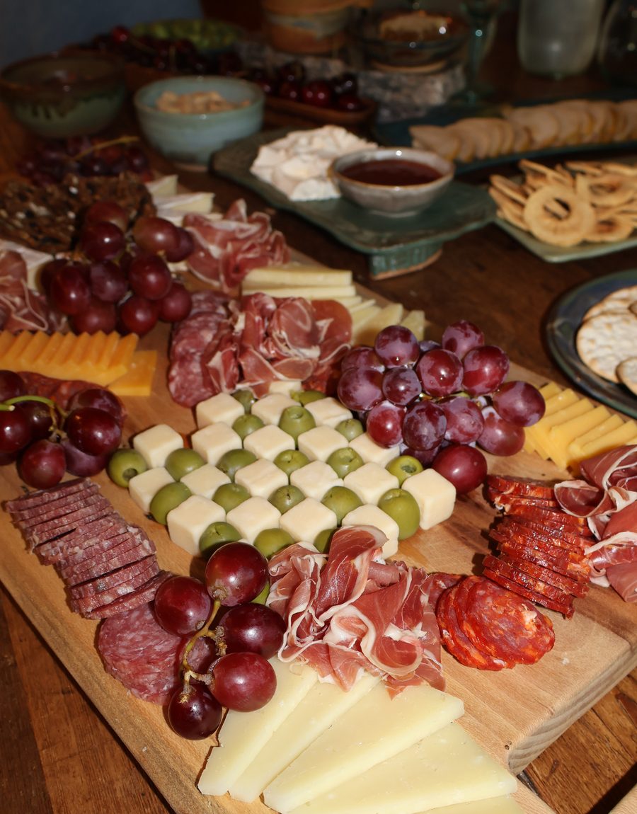 Salami, cheese and grapes on the board